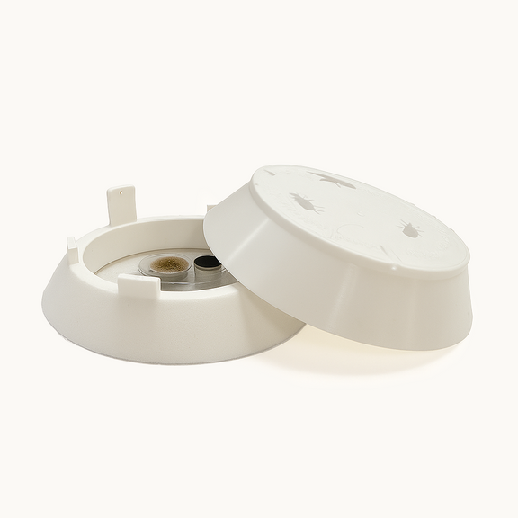Xlure FIT Fabric Insect Trap with lid open, showing cartridge inside a white plastic housing.